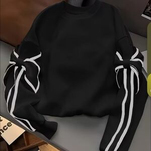 Stylish Black Top with White Accents